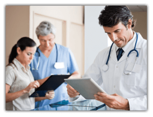 group of doctors with tablets